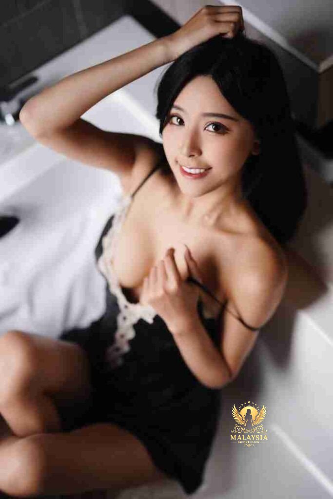 Malaysia Escort Girl Chinese Escort KL Jia Ying, a stunning woman with long dark hair, wearing lingerie. Sex Service Kuala Lumpur
