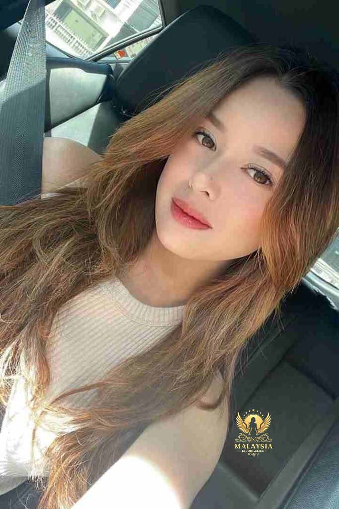Malaysia Escort Girl Selfie of a woman with long black hair wearing a black bra. Sex Service Kuala Lumpur