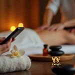Malaysia Escort Girl Person using phone during massage with candles and stones Sex Service Kuala Lumpur